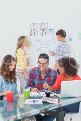 Happy designers brainstorming together Happy designers brainstorming together
