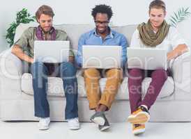 Handsome designers working with laptops