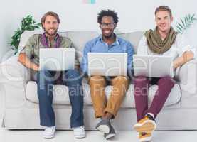 Portrait of handsome designers working with laptops