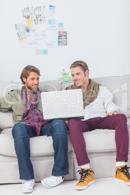 Designers working together with a laptop