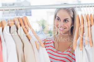 Pretty woman looking at clothes