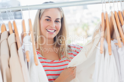Attractive woman looking at clothes