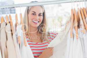 Attractive woman looking at clothes