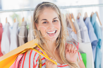 Cheerful woman standing in a clothing store