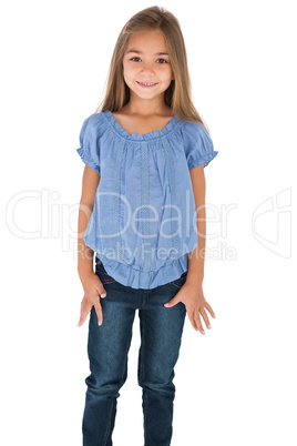 Cute little girl standing and smiling at camera