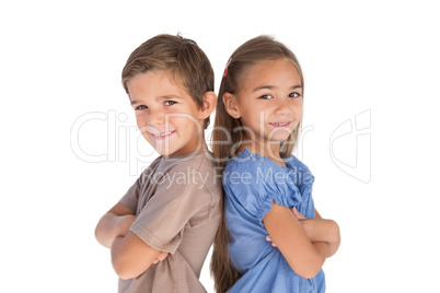 Children standing back to back with arms crossed