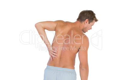 Man rubbing his back because of a back pain