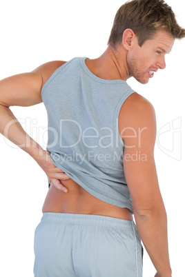 Man grimacing because of a back pain