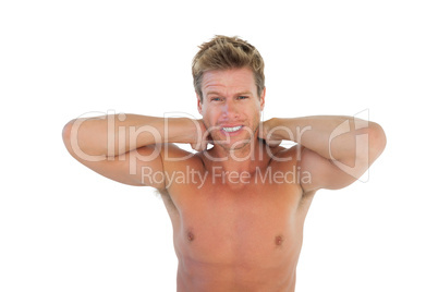 Shirtless man yelling and suffering from neck pain