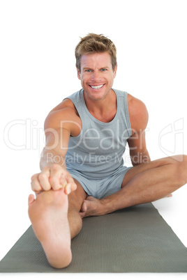 Cheerful man working out on the floor