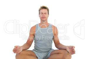 Portrait of a man meditating sat in lotus position