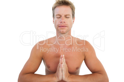 Man doing yoga and meditating