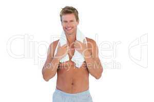 Shirtless man with a towel around his neck