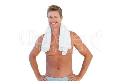 Shirtless man standing with hands on hips