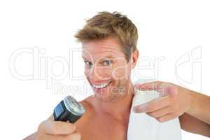 Cheerful man about to shave his stubble