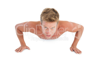 Shirtless man doing push ups