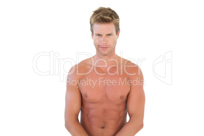 Handsome shirtless man flexing muscles