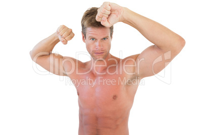 Shirtless attractive man showing his biceps