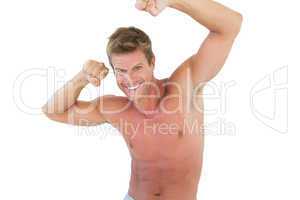 Smiling man flexing muscles