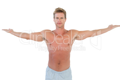 Shirtless man opening his arms