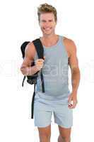 Man in sportswear holding rucksack