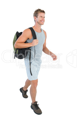 Handsome man in sportswear walking