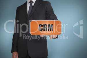 Businessman selecting orange tag with crm