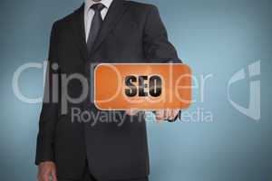 Businessman selecting orange tag with seo