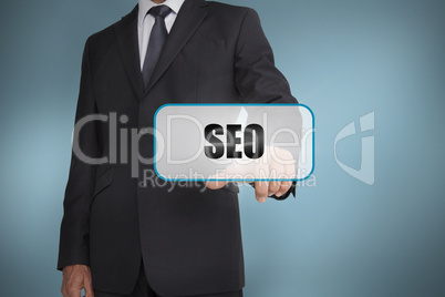 Businessman touching tag with seo written on it