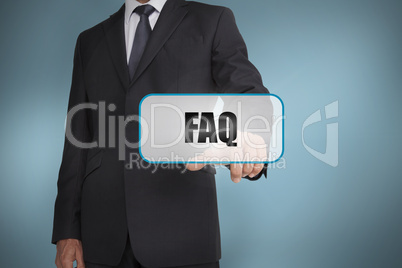 Businessman touching tag with faq written on it