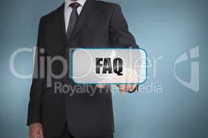 Businessman touching tag with faq written on it