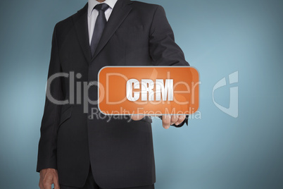 Businessman selecting orange tag with the word crm written on it