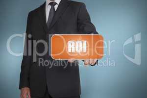 Businessman selecting orange tag with the word roi written on it