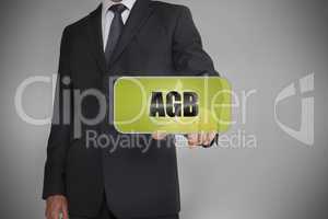 Businessman selecting green tag with the word agb written on it