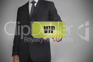 Businessman selecting green tag with the word vip written on it