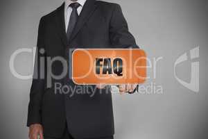 Businessman touching orange tag with the word faq written on it