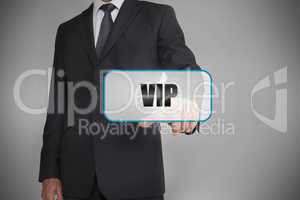 Businessman touching white tag with the word vip written on it