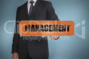 Businessman touching the word management