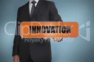 Businessman touching the word innovation