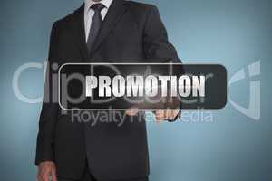 Businessman touching the word promotion written on black tag