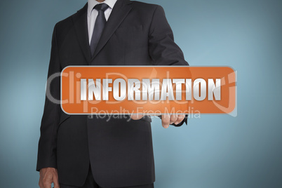 Businessman selecting the word information written on orange tag Businessman selecting the word information written on orange tag