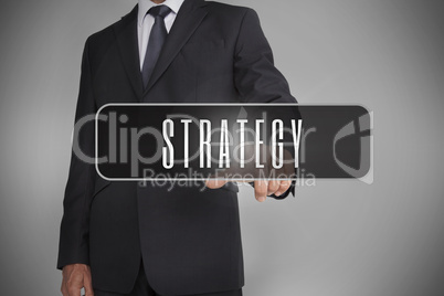 Businessman selecting label with strategy written on it