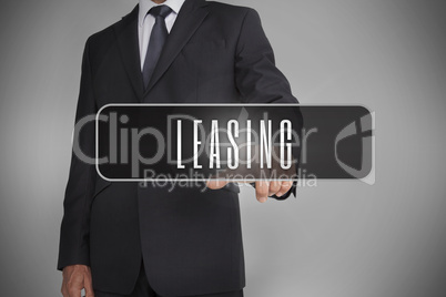 Businessman selecting label with leasing written on it