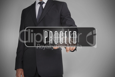 Businessman selecting label with proceed written on it