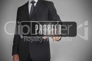 Businessman selecting label with proceed written on it