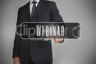 Businessman selecting label with webinar written on it