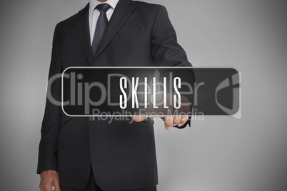 Businessman selecting label with skills written on it