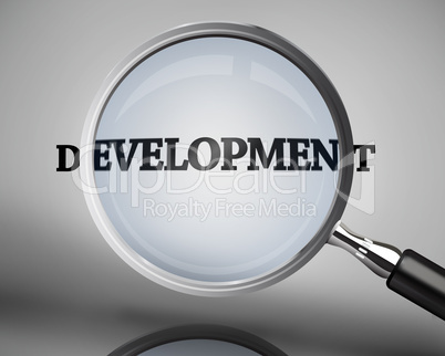 Magnifying glass showing development word