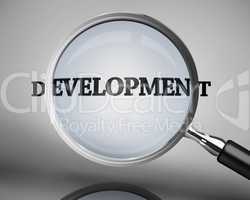 Magnifying glass showing development word