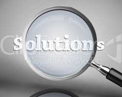 Magnifying glass showing solutions word in white
